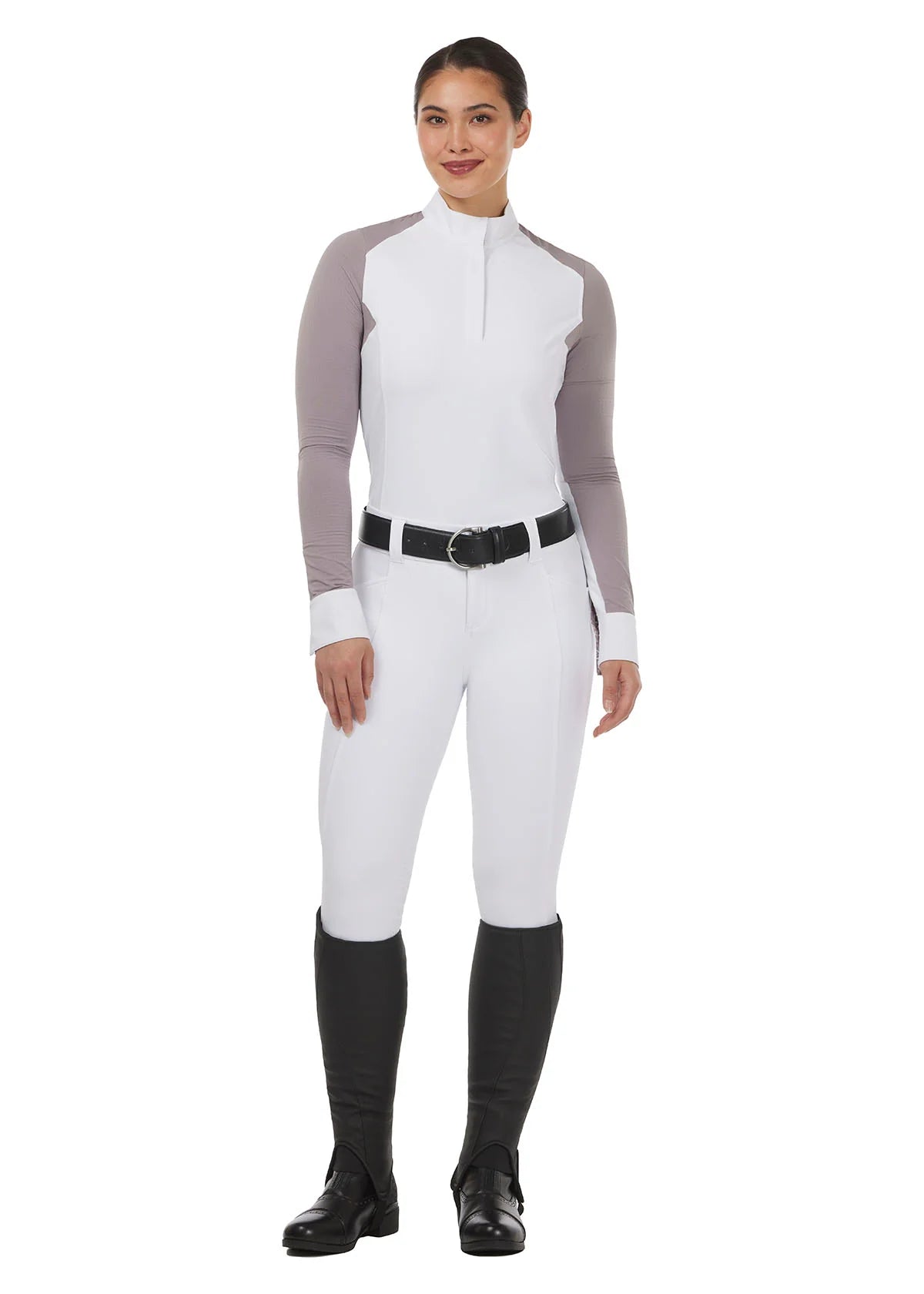 Full body front view of a model wearing the white Kerrits Affinity Pro Full Seat Breech and white/purple show top in front of a white background