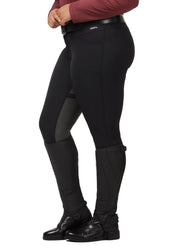 Side view of a model wearing the black Kerrits Crossover II Full Seat Breech on a white background