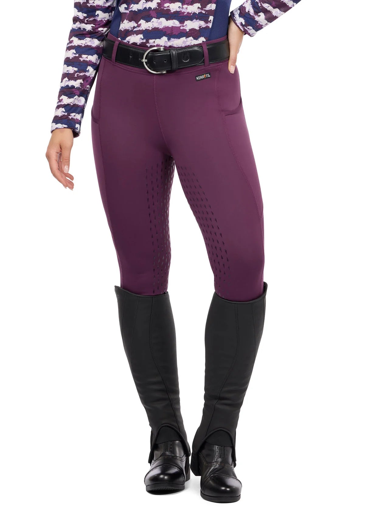 Front view of a female model wearing the purple Kerrits Coolcore Full Leg Tech Tight on a white background