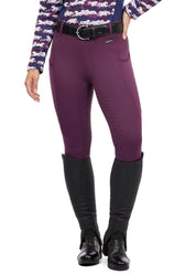 Front view of a female model wearing the purple Kerrits Coolcore Full Leg Tech Tight on a white background