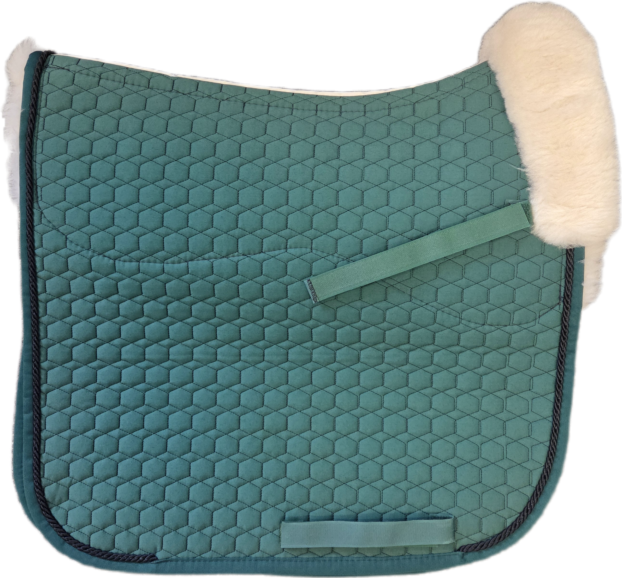 Green quilted dressage pad with black piping with natural  sheepskin lining