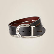 Front view of the black side of a rolled up Ariat Regal Reversible Belt on a plain background