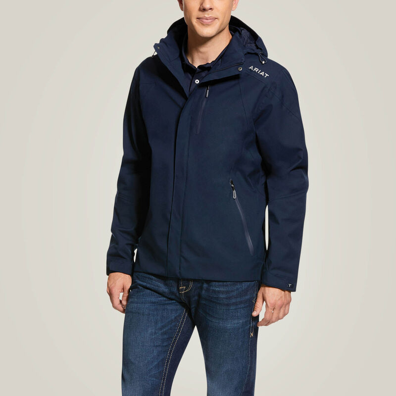 Front view of a male model wearing the Navy Ariat Men's Coastal Waterproof Jacket on a plain background