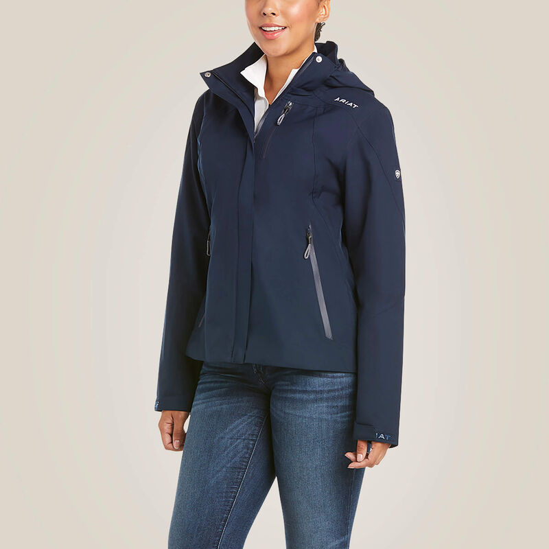 Front view of a female model wearing the Navy Ariat Coastal Waterproof Jacket on a plain background
