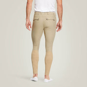 Back view of a male model wearing the Tan Ariat Men's Tri Factor Knee Patch Breeches on a plain background