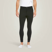 Front view of a male model wearing the Black Ariat Men's Tri Factor Knee Patch Breeches on a plain background