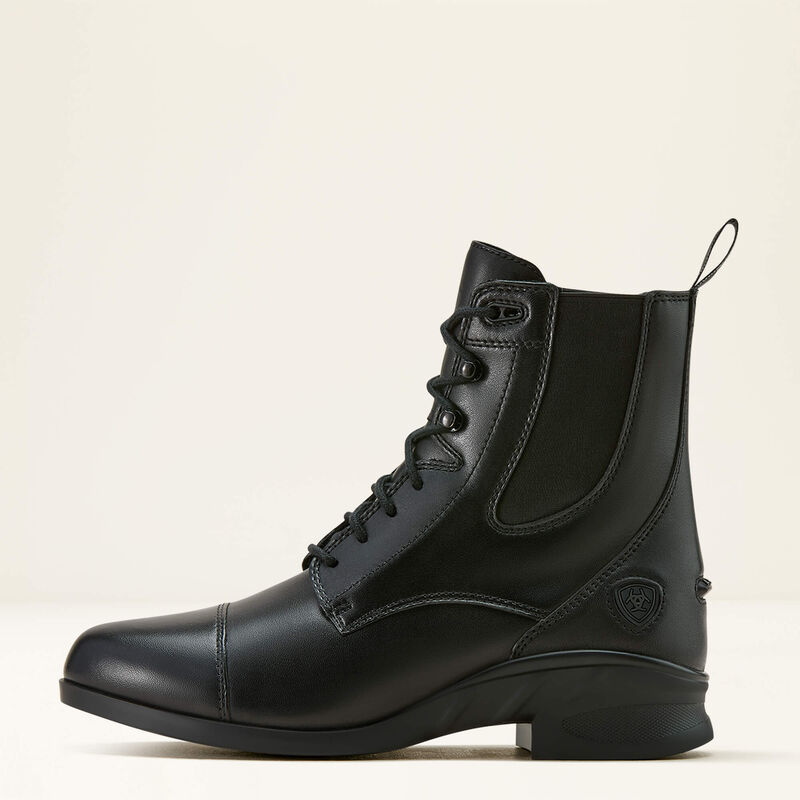 Side view of the black Ariat Heritage Lace Paddock Boot on a plain background