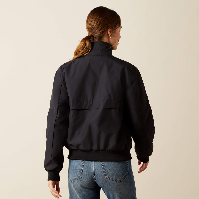 Back view of a female model wearing the Black Ariat Stable 2.0 Insulated Jacket on a plain background