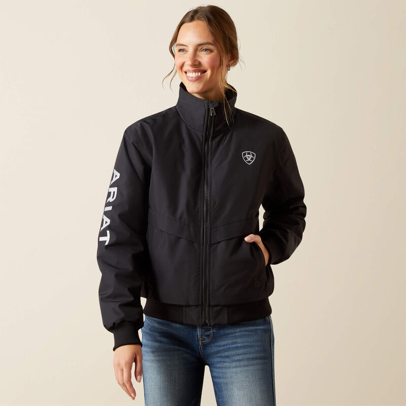 Front view of a female model wearing the Black Ariat Stable 2.0 Insulated Jacket on a plain background