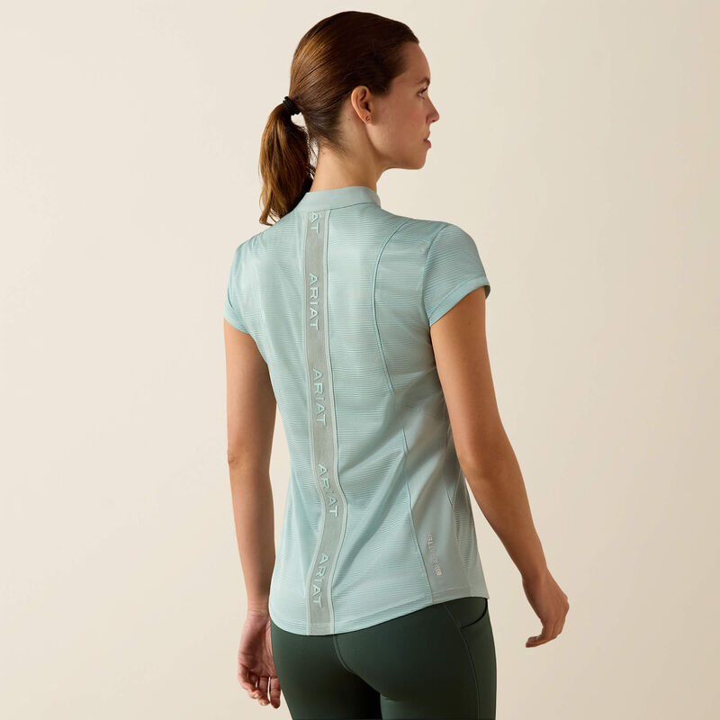 Back view of a model wearing the blue surf Ariat Breathe 1/2 Zip Baselayer on a plain background