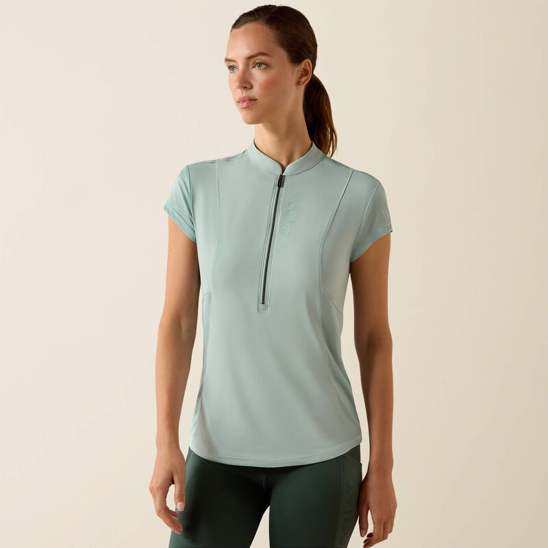 Front view of a model wearing the blue surf Ariat Breathe 1/2 Zip Baselayer on a plain background