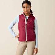 Front view of a young female model wearing the Vanilla Ice Horsin' Around Ariat Youth Bella Reversible Insulated Vest on a plain background