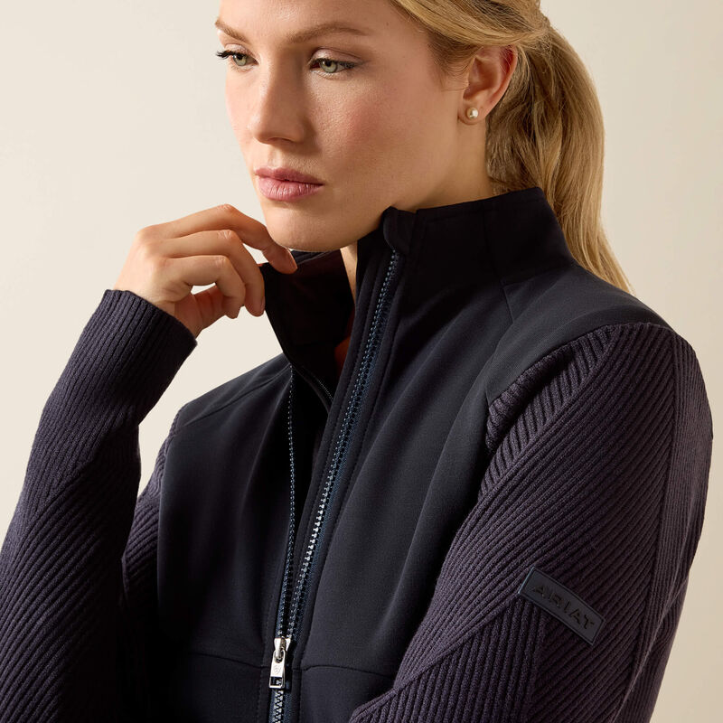 Side view of a model wearing the Ariat Skadi Full Zip
