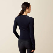 Back view of a model wearing the Show Navy Ariat Sustain Long Sleeve Baselayer