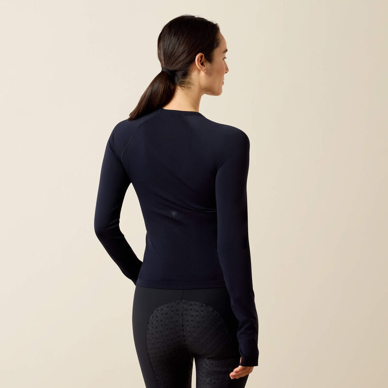 Back view of a model wearing the Show Navy Ariat Sustain Long Sleeve Baselayer