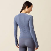 Back view of a model wearing the Grisaille Ariat Sustain Long Sleeve Baselayer