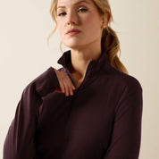 Close-up front view of a female model wearing the Chocolate Plum Ariat Cheviot 1/4 Zip Long Sleeve Baselayer on a plain background