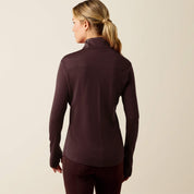 Back view of a female model wearing the Chocolate Plum Ariat Cheviot 1/4 Zip Long Sleeve Baselayer on a plain background