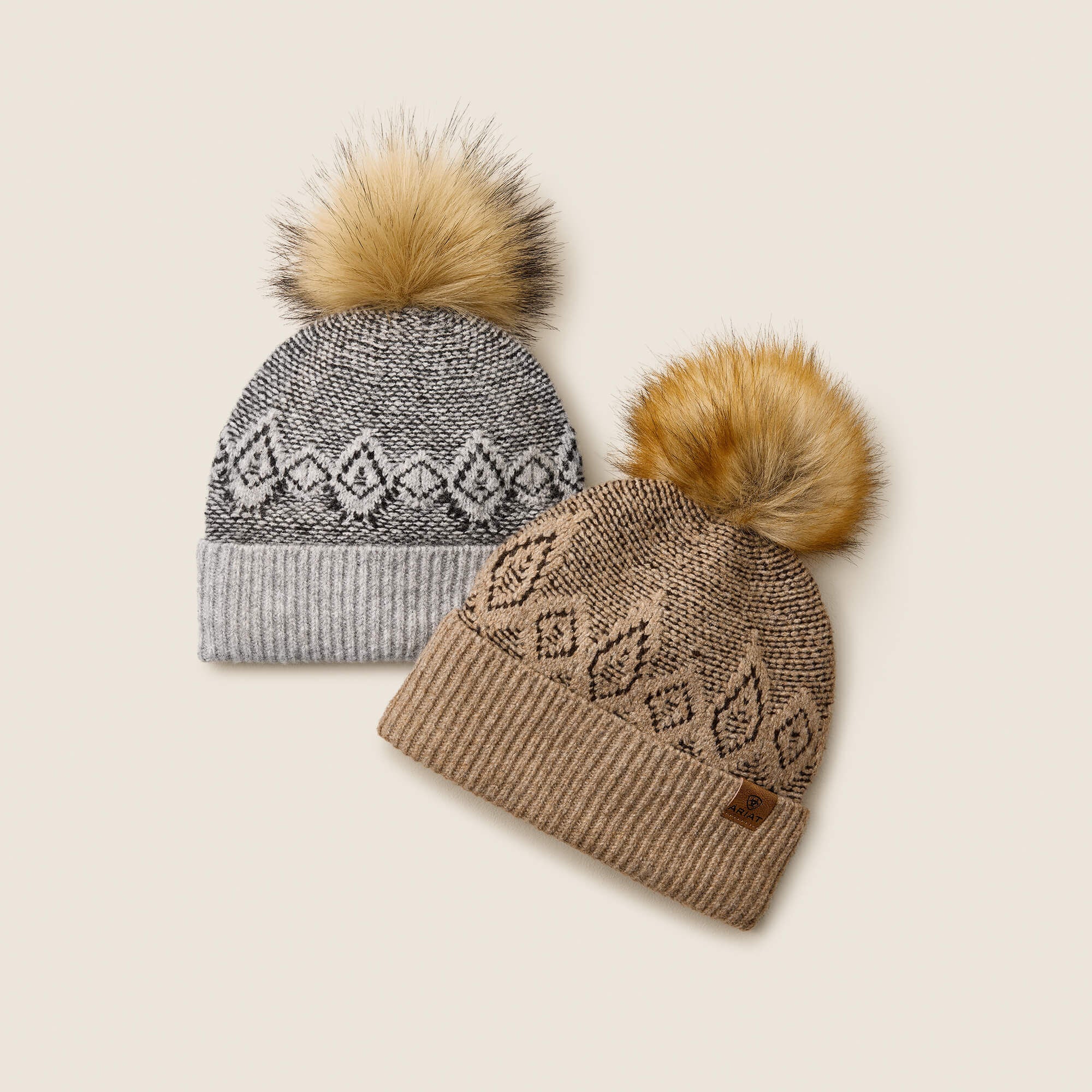 View of both the Gray and Earth Heather Ariat Willow Beanies on a plain background