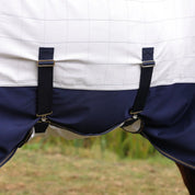Close up view of the belly band and straps on the Shires Tempest Original Summer Shield Set in white and navy