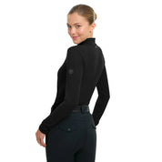 Angled back view of a female model wearing the Black RJ Classics Jamie Wrap Neck Schooling Shirt on a plain background