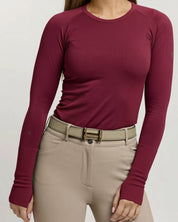 Front view of a female model wearing the Fizz TKEQ Kennedy Seamless Long Sleeve Shirt 2.0 on a plain background