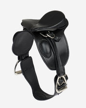 Angled front view of the LeMieux Toy Pony Dressage Saddle and Girth on a plain background
