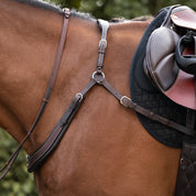 Side view of a horse wearing the Brown Kavalkade Jerome Breastplate while standing outside