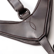 Close-up view of the Brown/Brass Kavalkade Robin 3-Point Elastic Breastplate on a white background