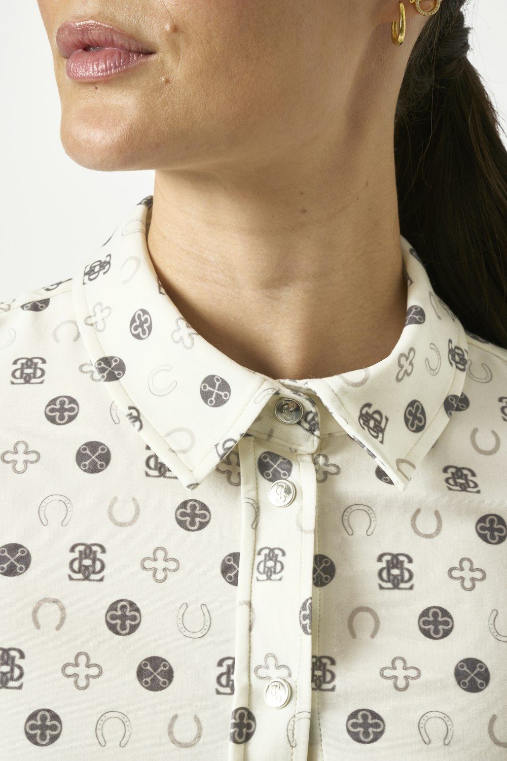 Close-up front view of a female model wearing the Off White PS of Sweden Valerie Printed Long Sleeve Shirt on a plain background