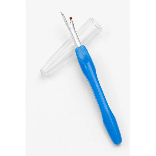 Seam Ripper with protective cap on a plain background