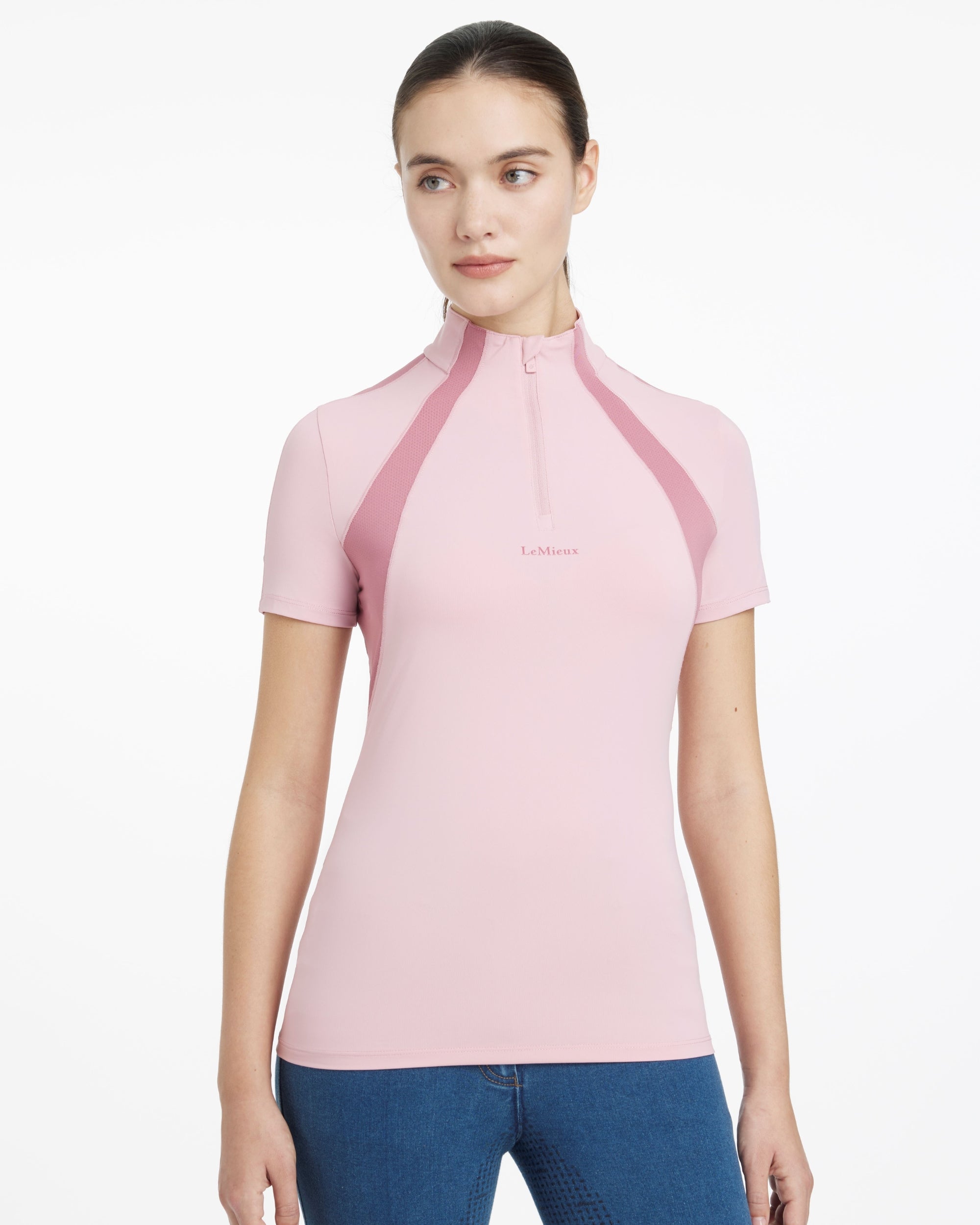 Front view of a female model wearing the Blossom LeMieux Maria Mesh Short Sleeve Sun Shirt on a plain background