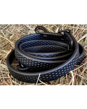 View of the Black PRO4MANCE Com4rt Grip Dog Leash on hay