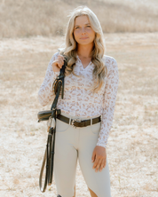 Front view of a female model wearing the Deinhardt Designs Impulsion & Straightness Lori Long Sleeve Signature Sunshirt while standing outside