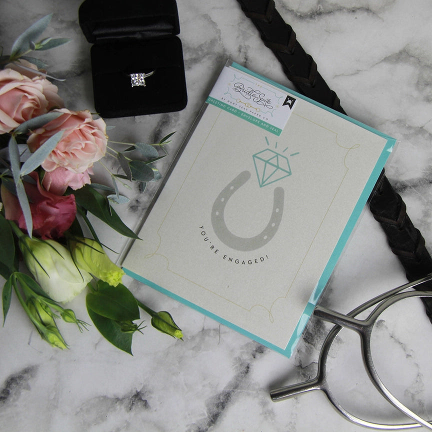 Front view of the You're Engaged Hunt Seat Paper Co. Greeting Card in its packaging