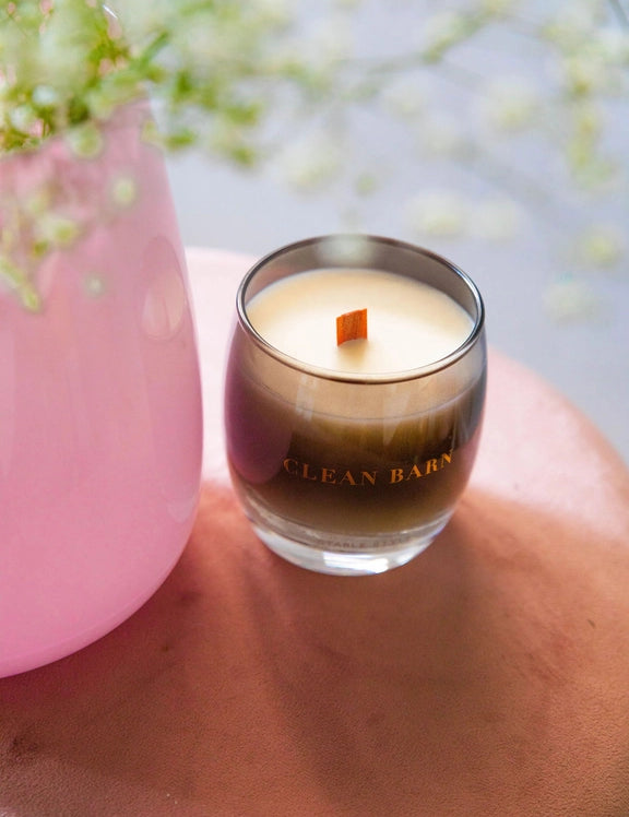 Angled front view of the Clean Barn Stable Style Soy Wax Candle