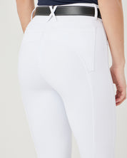 Back view of a female model wearing the Black LeMieux Monogram Belt over white breeches
