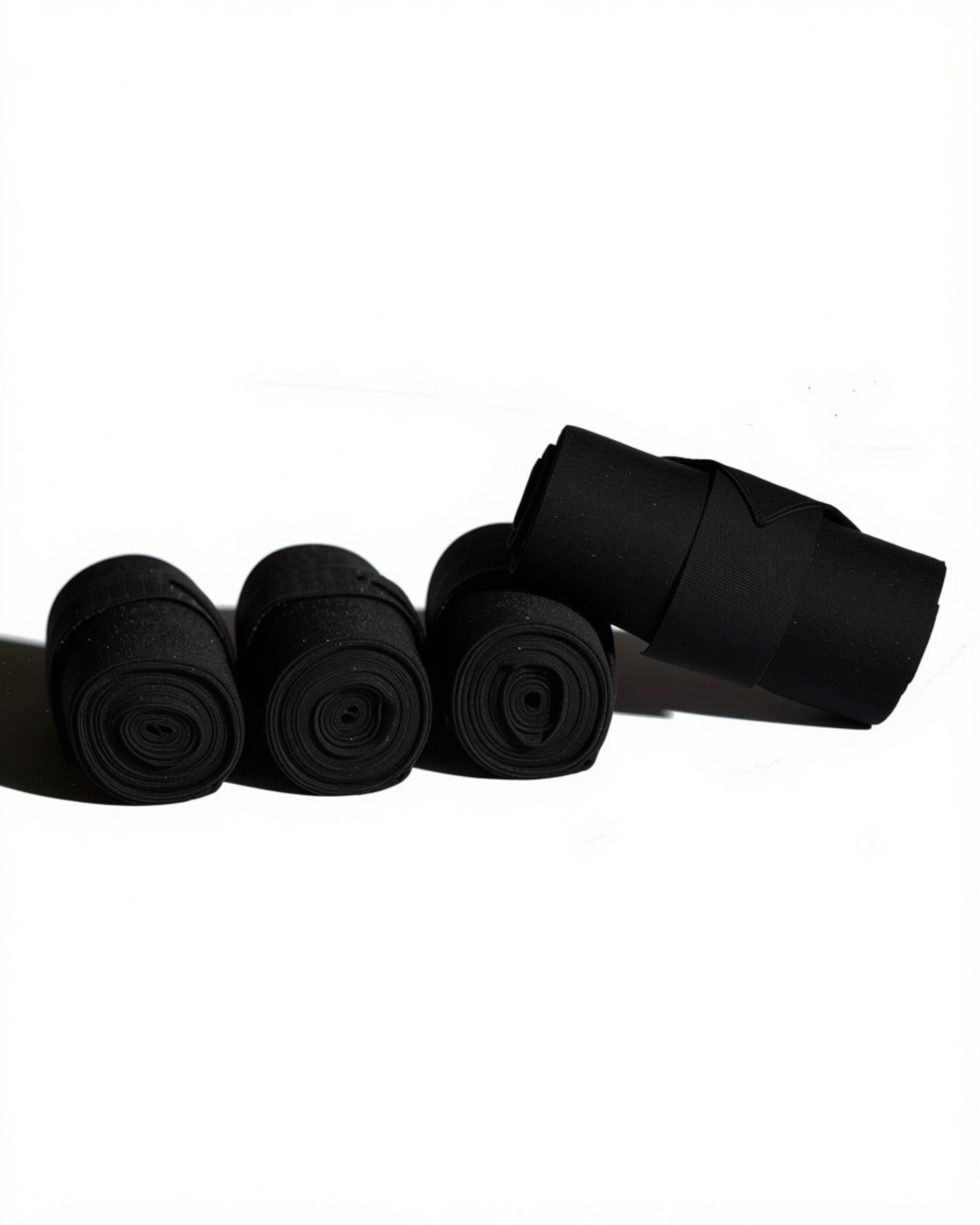 View of a set of Black Vac's 12 Foot Standing Bandages on a white background