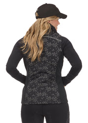 Back view of a model wearing the Black Happy Herds Kerrits Horse Reflection Quilted Vest on a white background