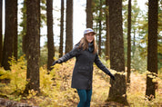 Angled front view of a model wearing Carbon Kerrits Weatherlock Three-Quarter Length Jacket