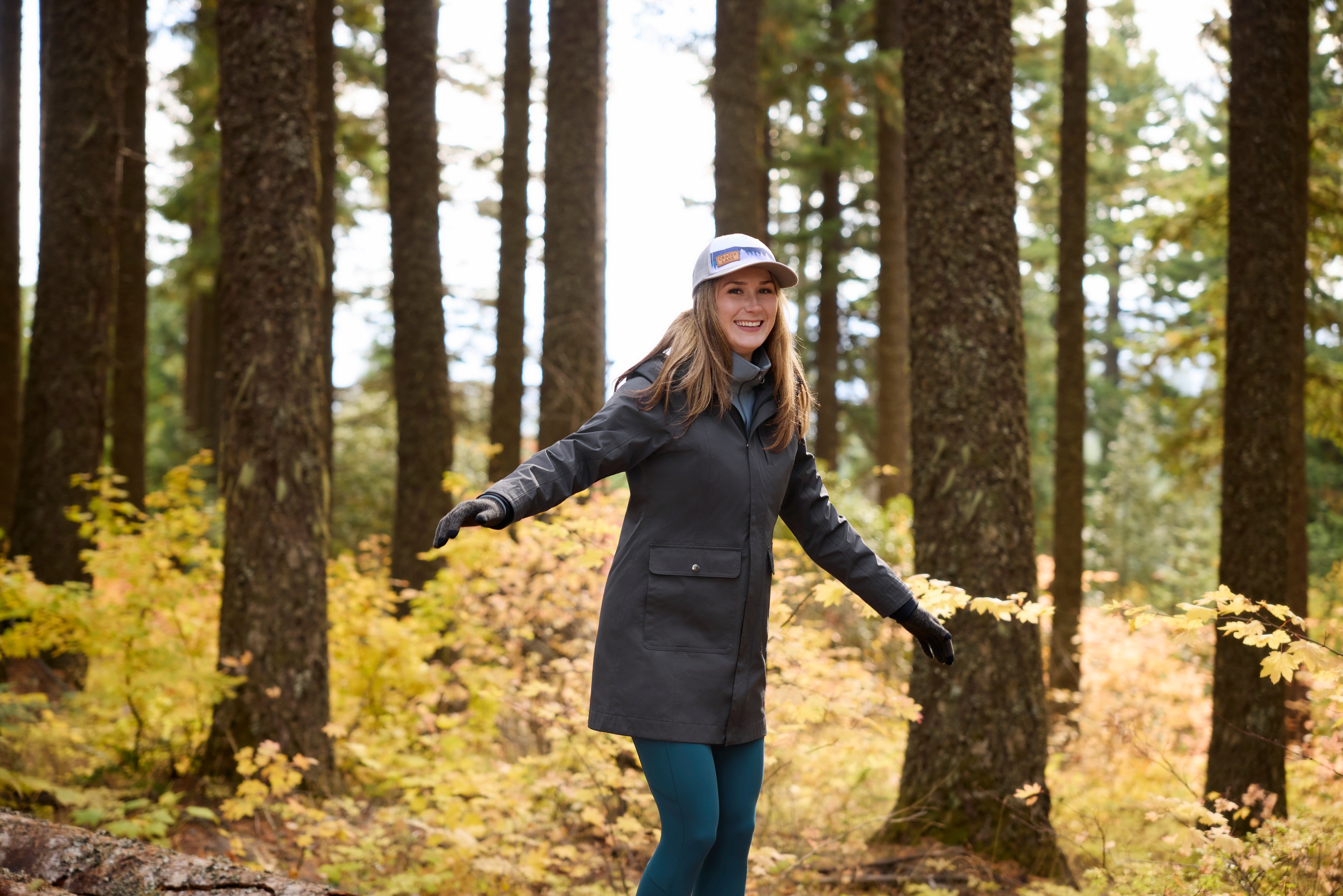 Angled front view of a model wearing Carbon Kerrits Weatherlock Three-Quarter Length Jacket