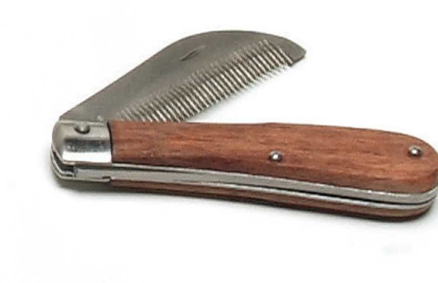 View of the Equi-Essentials Folding Stripping Comb with Wooden Handle on a plain background