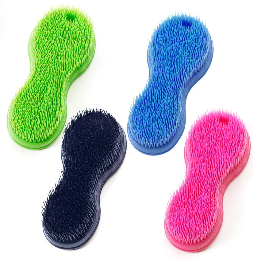 View of the assorted colors of the Equi-Essentials Original Wonder Brush on a white background