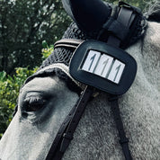 View of the Pro4mance 3 Digit Number ID attached to the bridle on a gray horse