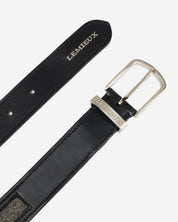 Close-up view of the buckle on the Black LeMieux Crystal Insert Belt on a plain background