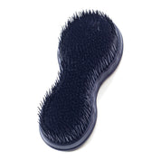 View of the underside of the Wonder Brush in navy showing the plastic bristles