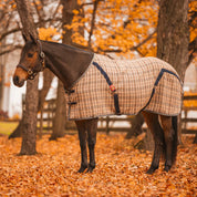 Tan and navy plaid horse sheet shown on bay horse with orange fall woods in background