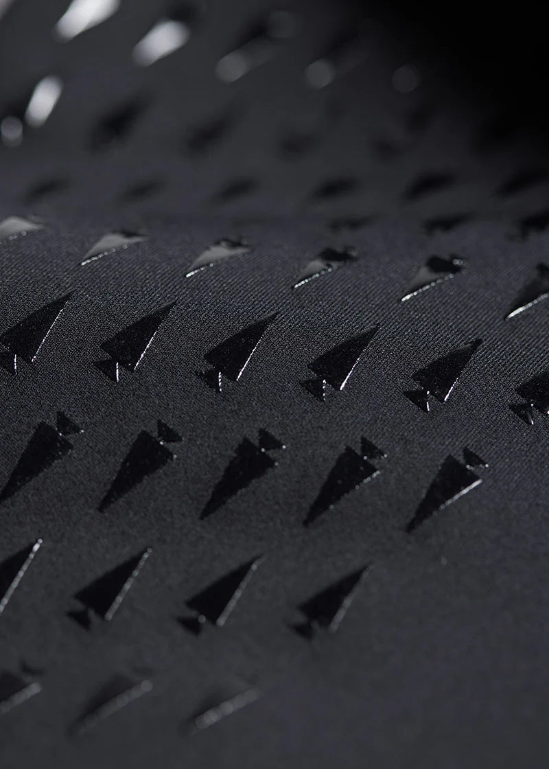 Close-up view of the fabric on the black Kerrits Kids Coolcore Full Seat Tech Tights