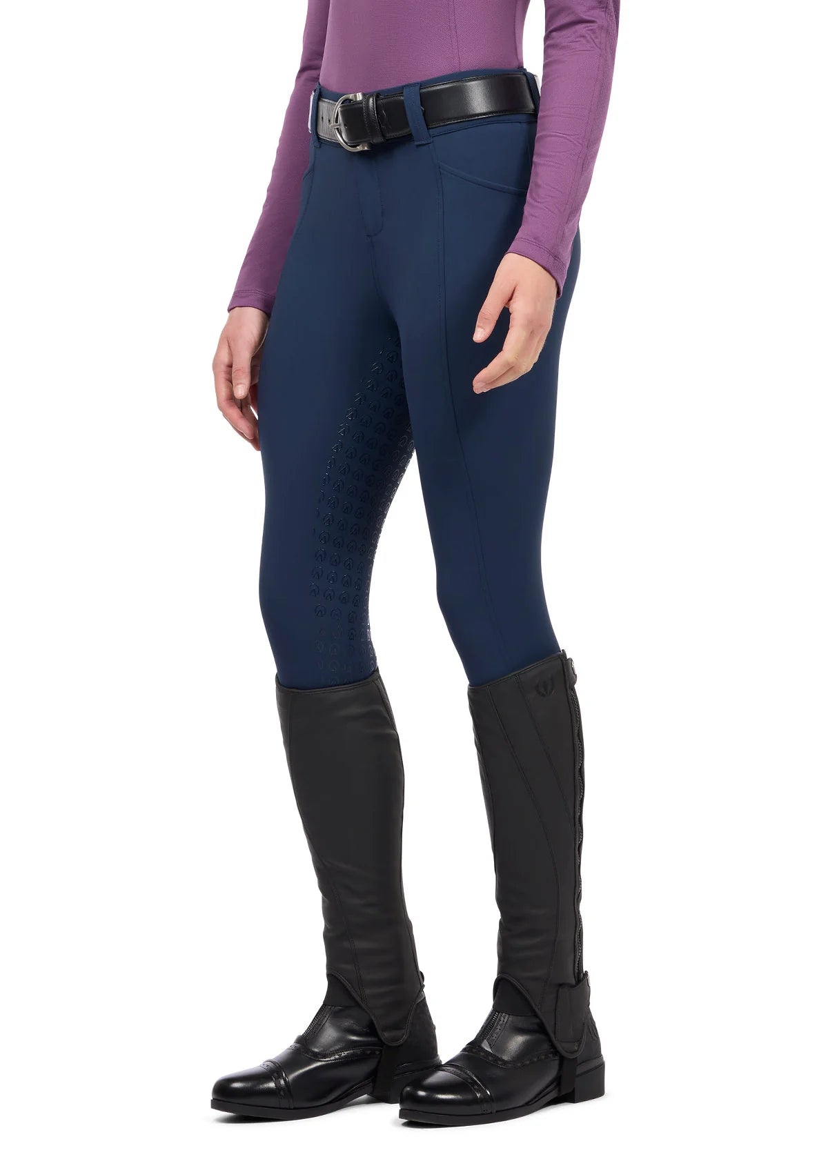 Angled front view of a model wearing the blue Kerrits Affinity Pro Full Seat Breech on a white background