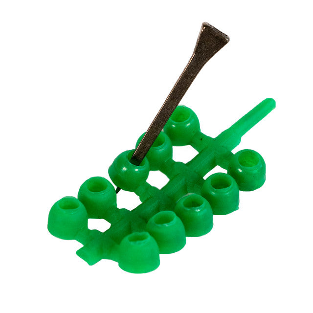 View of the green Nunn Finer Easiest Plugs Yet on a white background